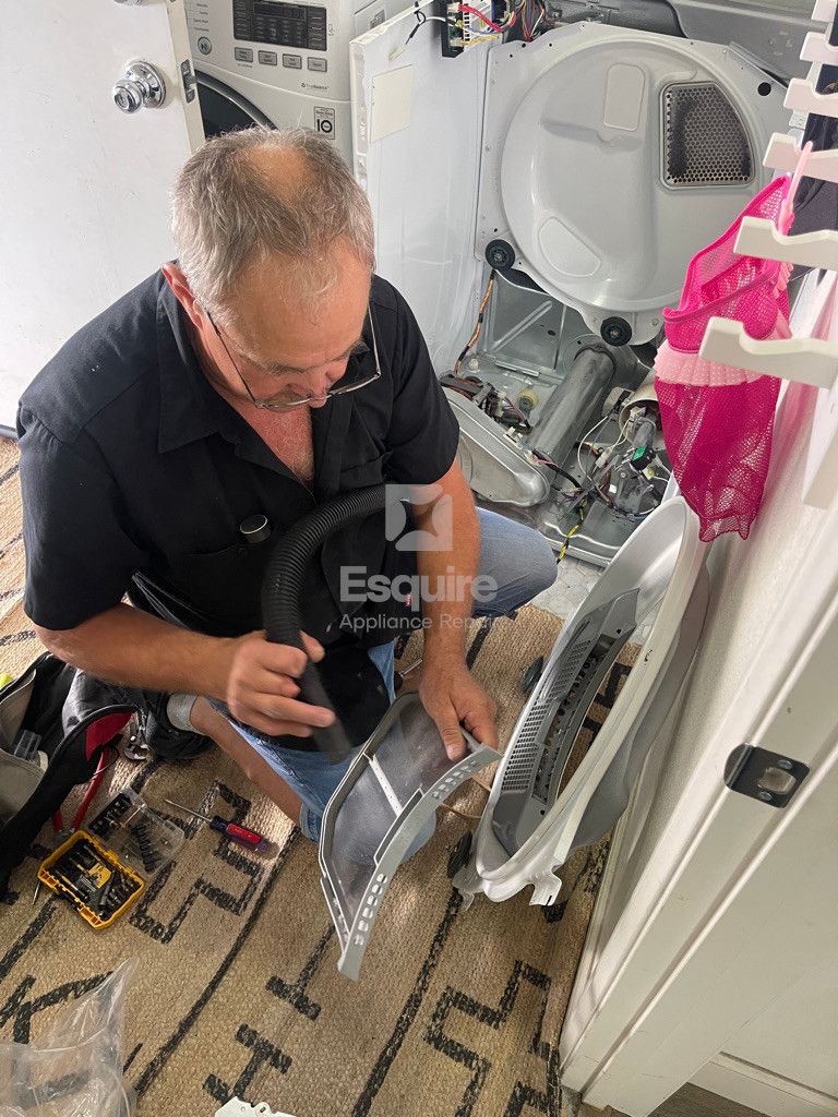 Esquire Appliance Repair technician working on a dryer in Orange County