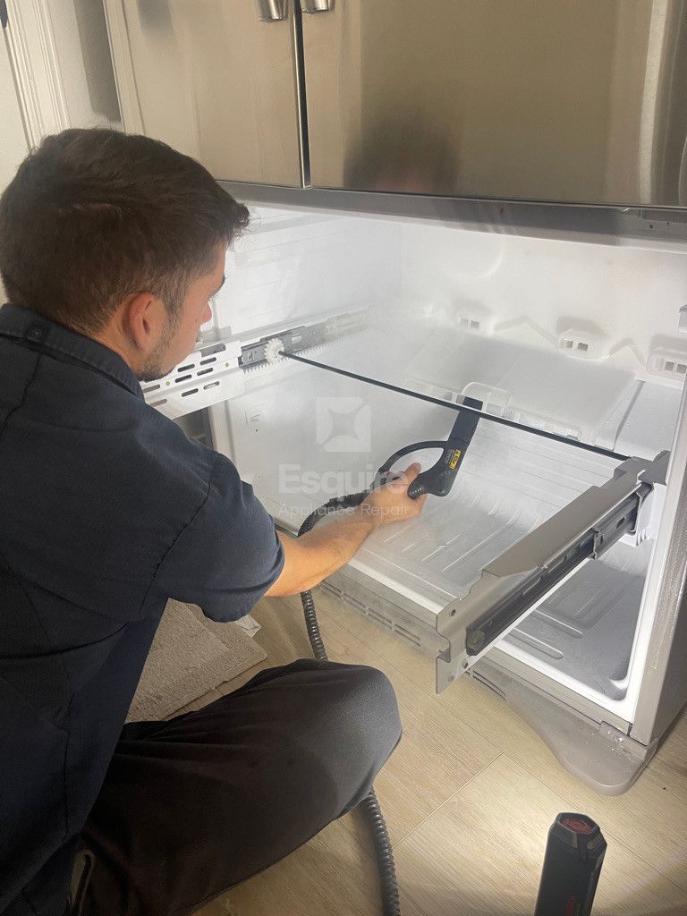 Esquire Appliance Repair technician working on a freezer in Orange County