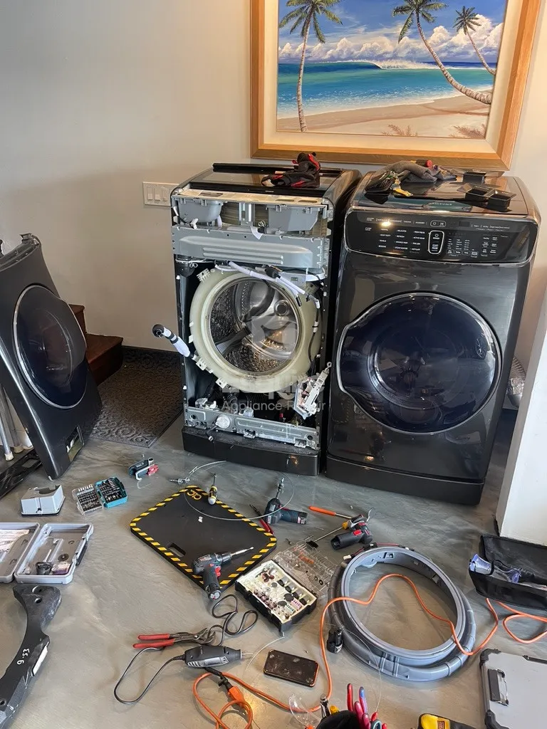Front-load washing machine open mid-cycle with laundry inside